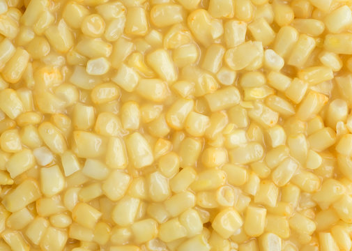 Close view of shoepeg white corn in a butter sauce.