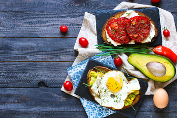 Delicious Tasty Avocado Eggs and Tomato Cheese Toasts