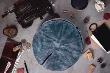 A finance background with a vintage calculating machine, US Dollars and Euro coins. Save money or investment concept. Top view, copy space.