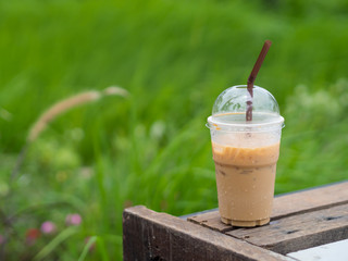 Ice coffee on green background
