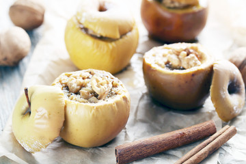 Baked apples on grey wooden table