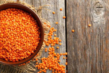 Red lentils on a grey wooden table