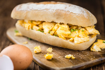 Scrambled Eggs on a bun (close-up shot)