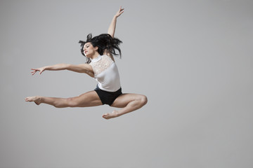 Graceful Caucasian ballet dancer in mid-air