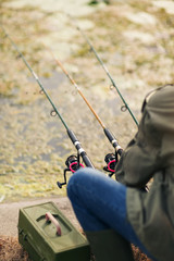 Close up of male hands holding fishing rod