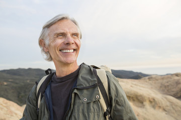 Older Caucasian man standing outdoors