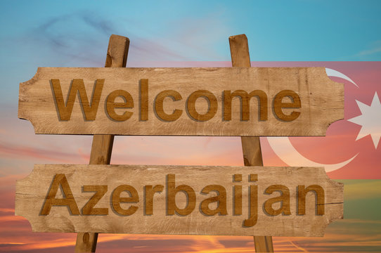 Welcome to  Azerbaijan sing on wood background with blending national flag