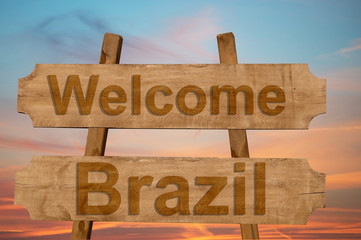 Welcome to  Brazil sing on wood background