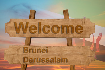 Welcome to  Brunei Darussalam sing on wood background with blending national flag