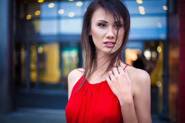 Sexy young beautiful woman in red dress