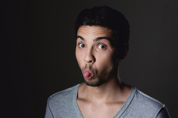 Obraz premium Portrait of a normal boy fun over grey background / Attractive y