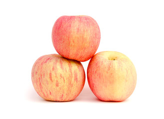 The heap of red apples packed in plastic film on white background