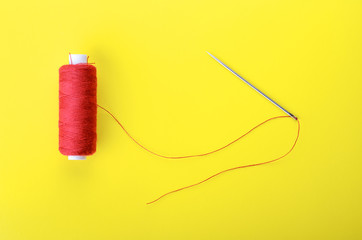 needle with the red thread
