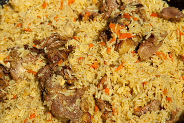 Arabic national rice food called pilaf cooked with fried meat, above