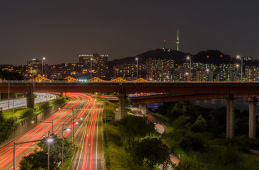 Traffic light trails on motorway highway at night in Seoul ,Sout