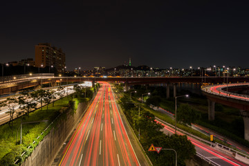 Fototapeta na wymiar Traffic light trails on motorway highway at night in Seoul ,Sout