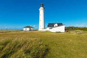 white lighthouse in nature, landscape of Denmark