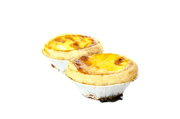 egg tart in foil on white isolated