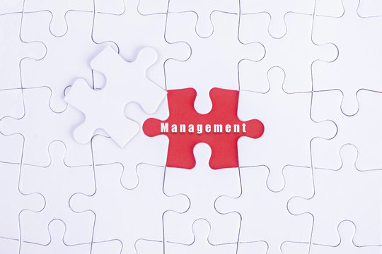 Missing white puzzle with Management  word and copyspace area.