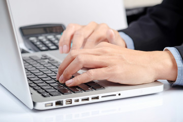 Fototapeta na wymiar Business man hands typing on a PC or laptop keyboard