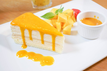 Mango Crepe, Layer Crepe Cake with Topping, served with fruits