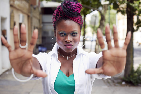 Young woman hold her hands out showing her palms