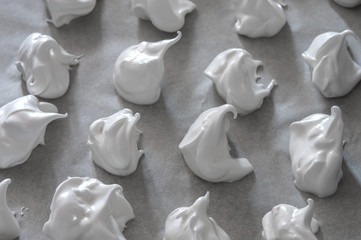 Fresh delicious meringue on baking paper