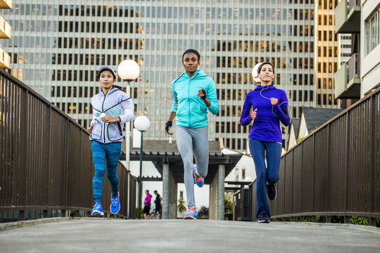 Women running in city