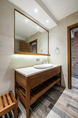 Lavatory and mirror in modern bathroom interior