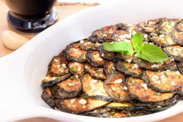 Zucchini scapece. Fried zucchini flavored vinegar and mint.