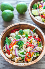 Two bowls of chicken noodle stir-fry