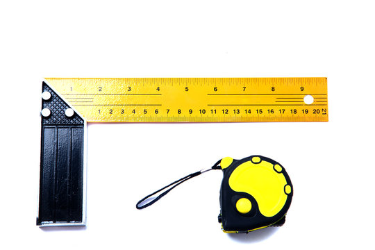 Iron ruler with angle bar, isolated on a white background with tape measure