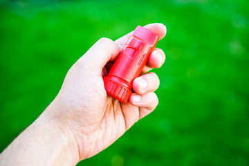 Close-up of hand holding respirator