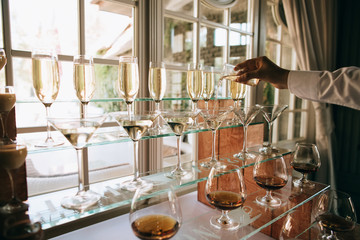 Catering service. waiter pouring champagne. Wedding drink bar. 