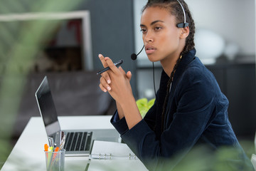 charming young woman in office
