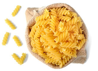 uncooked fusilli pasta in sack