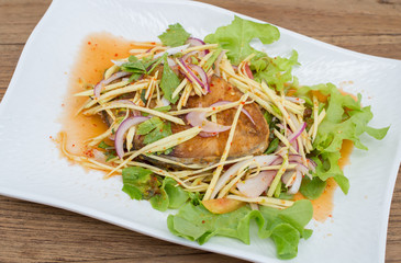 Fillet topped with a spicy dressing.