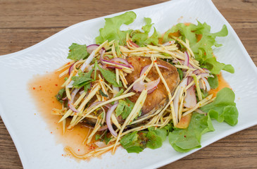 Fillet topped with a spicy dressing.