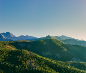 Obraz premium Green mountains in evening haze. Vintage filter
