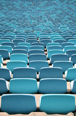Green Stadium seating in rows from behind