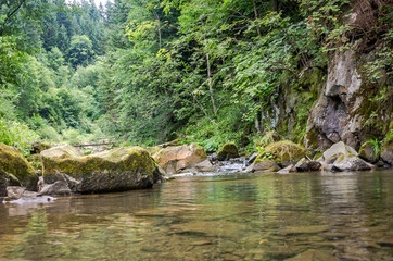 Naklejka na ściany i meble Mountain river with waterfall and rocks at national park in the Skole Beskids near Lviv