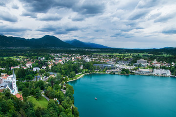 Fototapeta na wymiar Bled town with Julian Alps mountains in background in Slovenia
