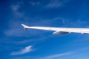 wing of aircraft in blue sky