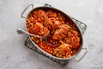 Chicken stew or ragout with nuts, carrot and tomato sauce