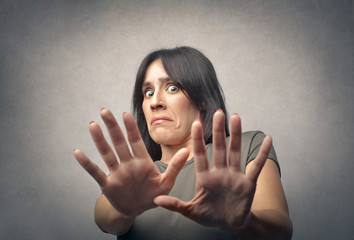 Disgusted woman pushing away someone