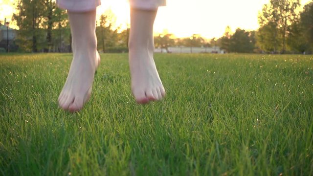 Barefoot Woman Jumping In Slow Motion On Sunset
