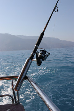 A fishing rod on the back of a fishing boat during a fishing trip in turkey, 2016