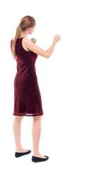 Fototapeta premium skinny woman funny fights waving his arms and legs. Isolated over white background. A girl in a burgundy dress sleeveless boxing.
