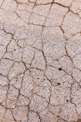 cracks in the old pavement as a background