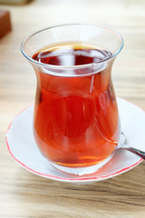 glass of Turkish tea, on wooden table